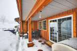 This charming property boasts a cozy covered patio, perfect for enjoying the outdoors even in winter.