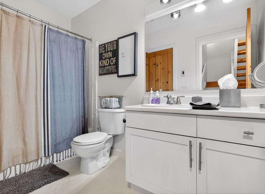 Step into a beautifully designed bathroom that exudes comfort and style.