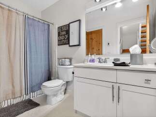 Step into a beautifully designed bathroom that exudes comfort and style.