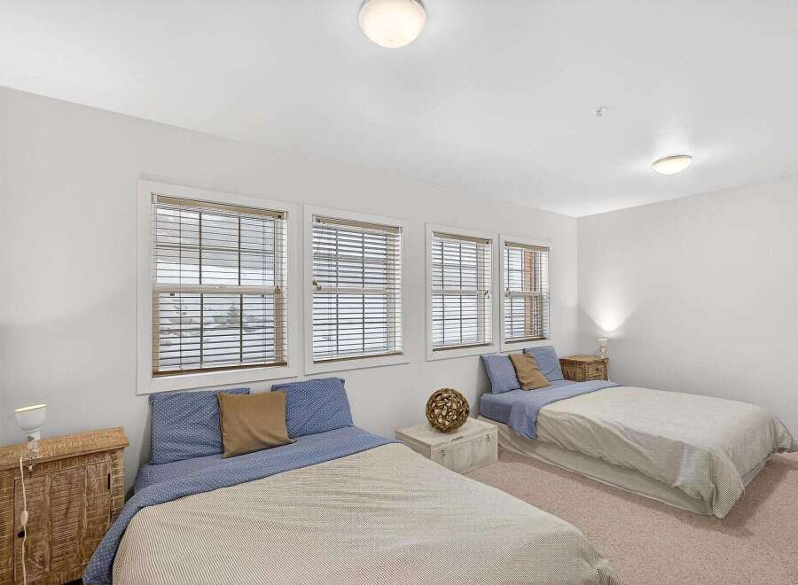 This cozy bedroom features two twin beds, perfect for guests or roommates.