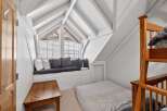 Discover the charm of this unique property featuring a cozy attic bedroom.