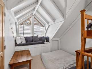 Discover the charm of this unique property featuring a cozy attic bedroom.