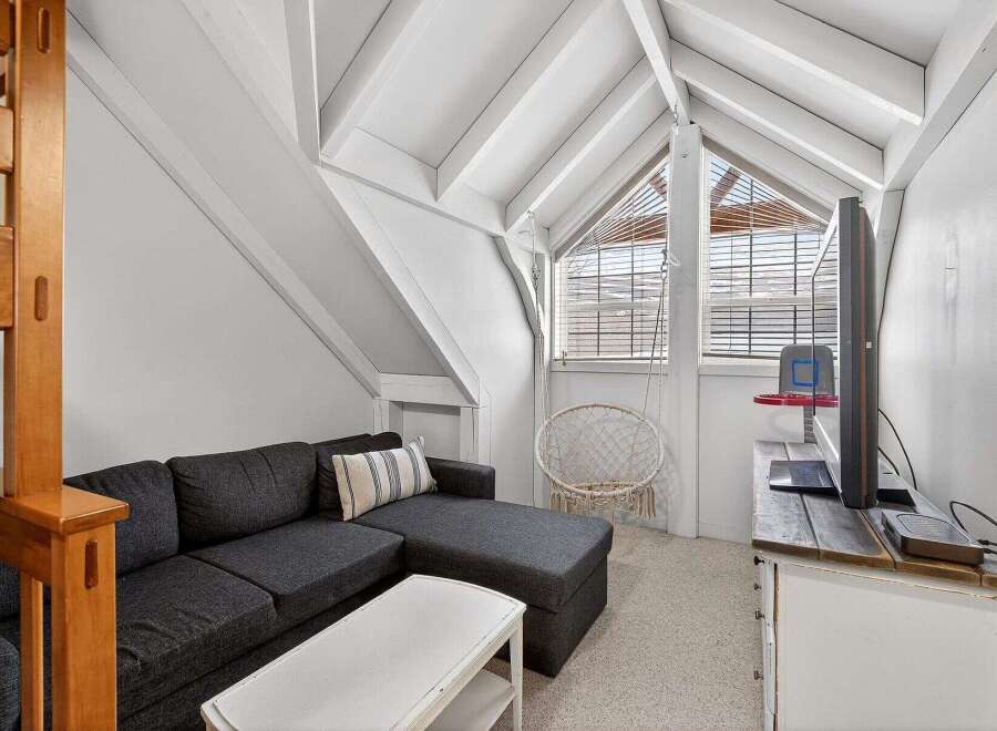 Discover the charm of this unique property! This cozy living space features a stylish sectional sofa, perfect for relaxing.