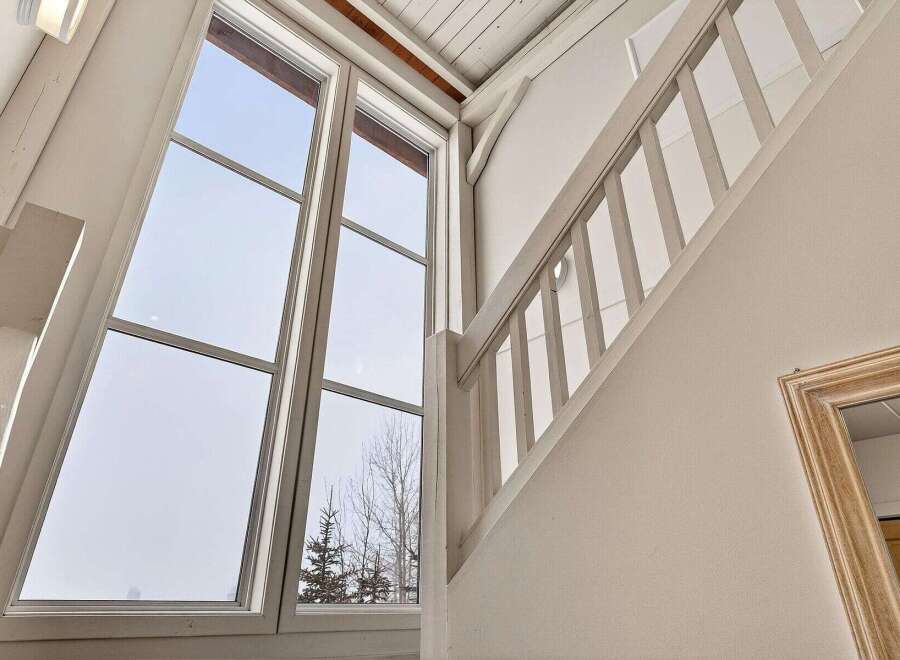 This stunning property boasts a bright and airy interior, highlighted by expansive windows that flood the space with natural light.
