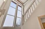 This stunning property boasts a bright and airy interior, highlighted by expansive windows that flood the space with natural light.