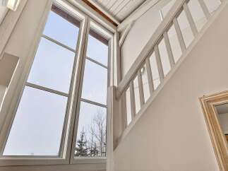 This stunning property boasts a bright and airy interior, highlighted by expansive windows that flood the space with natural light.