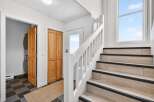 This stunning property features a beautifully designed staircase leading to the upper levels.