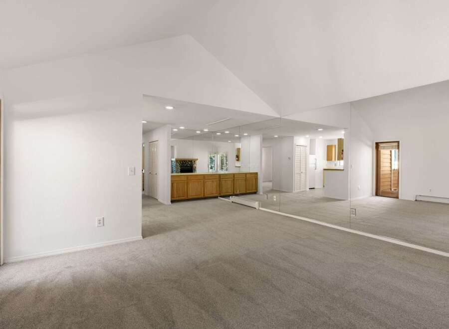 Step into this spacious and inviting home, featuring a bright and airy living area.