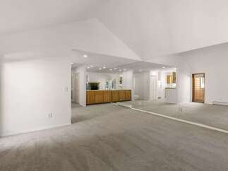 Step into this spacious and inviting home, featuring a bright and airy living area.