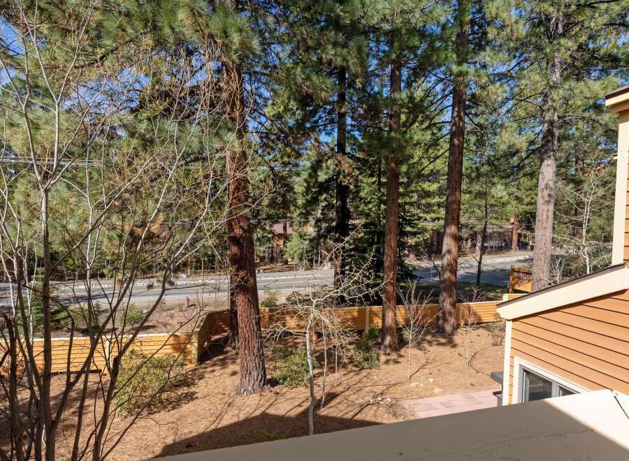 Enjoy the tranquility of this property, surrounded by lush trees and a serene outdoor space.