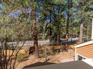 Enjoy the tranquility of this property, surrounded by lush trees and a serene outdoor space.