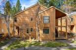 Discover a charming two-story home with a warm, inviting exterior.