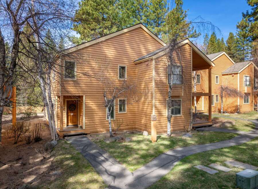 Discover this charming property, featuring a warm, inviting exterior with natural wood siding.