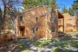 Discover this charming property, featuring a warm, inviting exterior with natural wood siding.