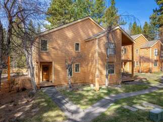 Discover this charming property, featuring a warm, inviting exterior with natural wood siding.