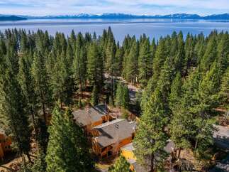 Nestled amidst a lush forest, this property offers a serene escape with stunning views.