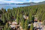 Nestled amidst a lush forest, this property offers a serene escape with stunning lake views.