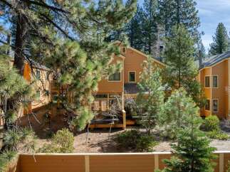 Nestled amidst lush greenery, this charming property offers a serene escape.