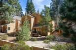 Nestled amidst towering pines, this charming property offers a serene retreat.