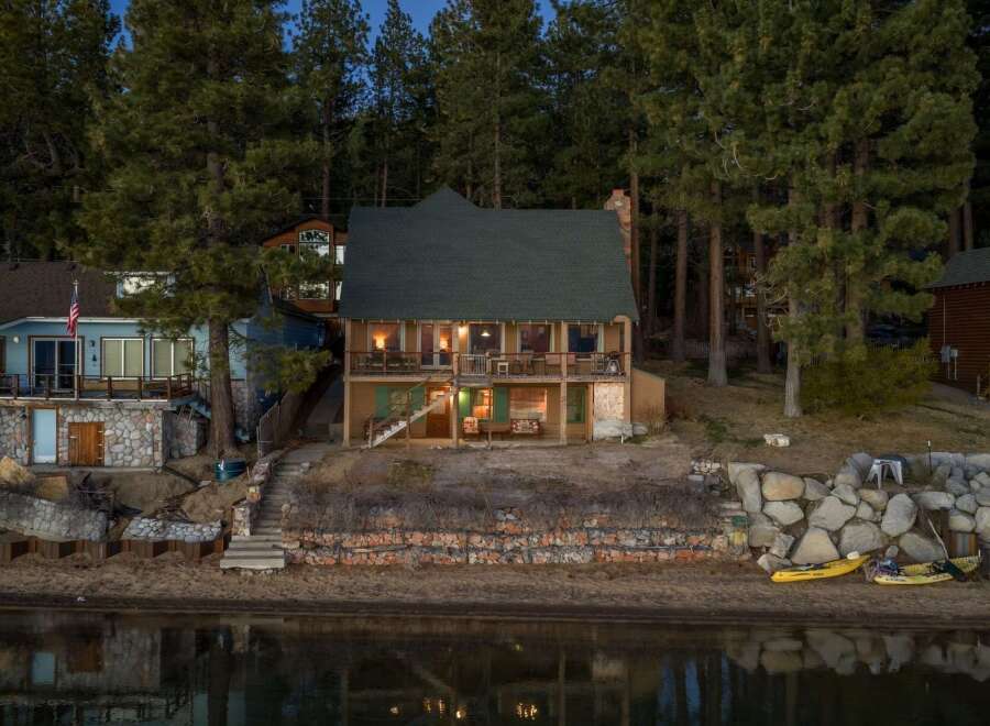 Nestled along the serene waterfront, this charming property offers a tranquil escape.