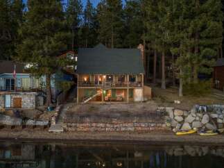 Nestled along the serene waterfront, this charming property offers a tranquil escape.