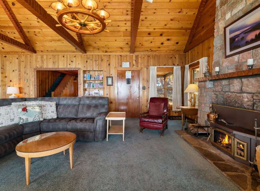 Step into a cozy living space with a rustic charm.