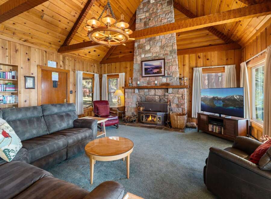 Step into this cozy cabin with a stunning stone fireplace, perfect for those chilly evenings.