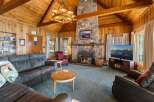 Step into this cozy cabin with a stunning stone fireplace, perfect for those chilly evenings.