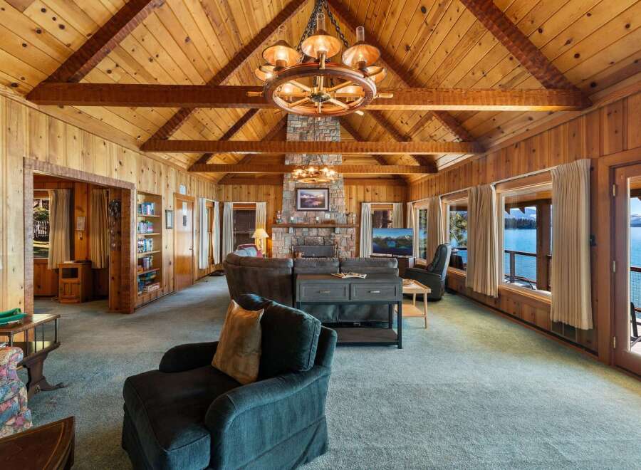 Step into luxury with this stunning property, boasting a spacious living area with a cozy fireplace and breathtaking views.