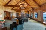 Step into luxury with this stunning property, boasting a spacious living area with a cozy fireplace and breathtaking views.