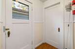Step into this inviting space, featuring a bright entryway with two doors.