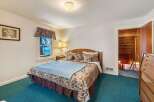 This cozy bedroom offers a serene retreat with its inviting ambiance and comfortable furnishings.