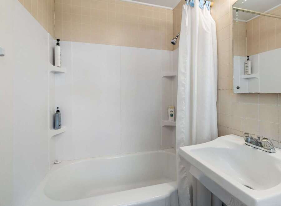 This bathroom features a clean and bright design, perfect for a fresh start.