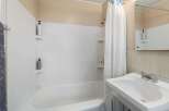 This bathroom features a clean and bright design, perfect for a fresh start.