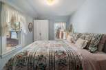 Step into a charming bedroom retreat, perfect for relaxation and comfort.