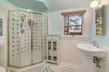 Step into a beautifully designed bathroom featuring a modern glass shower enclosure.