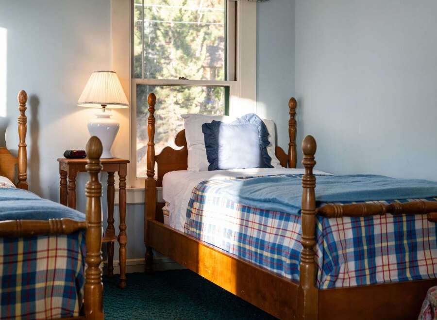 This charming bedroom features two twin beds, perfect for guests or family.