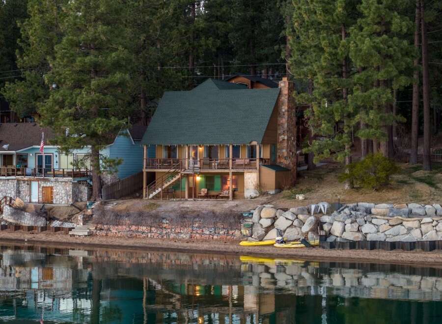 Discover your dream lakeside retreat! This charming property boasts a stunning waterfront location, perfect for enjoying serene views and outdoor activities.