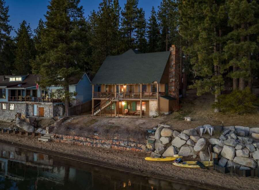 Escape to your lakeside dream home! This stunning property boasts a charming cabin with a cozy fireplace, perfect for chilly evenings.