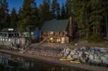 Escape to your lakeside dream home! This stunning property boasts a charming cabin with a cozy fireplace, perfect for chilly evenings.