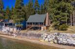 Discover your dream lakeside retreat! This stunning property boasts a charming two-story house with a cozy fireplace and a spacious deck, perfect for enjoying breathtaking views.