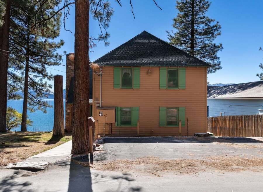 Charming two-story home with a stunning lake view.