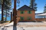 Charming two-story home with a stunning lake view.