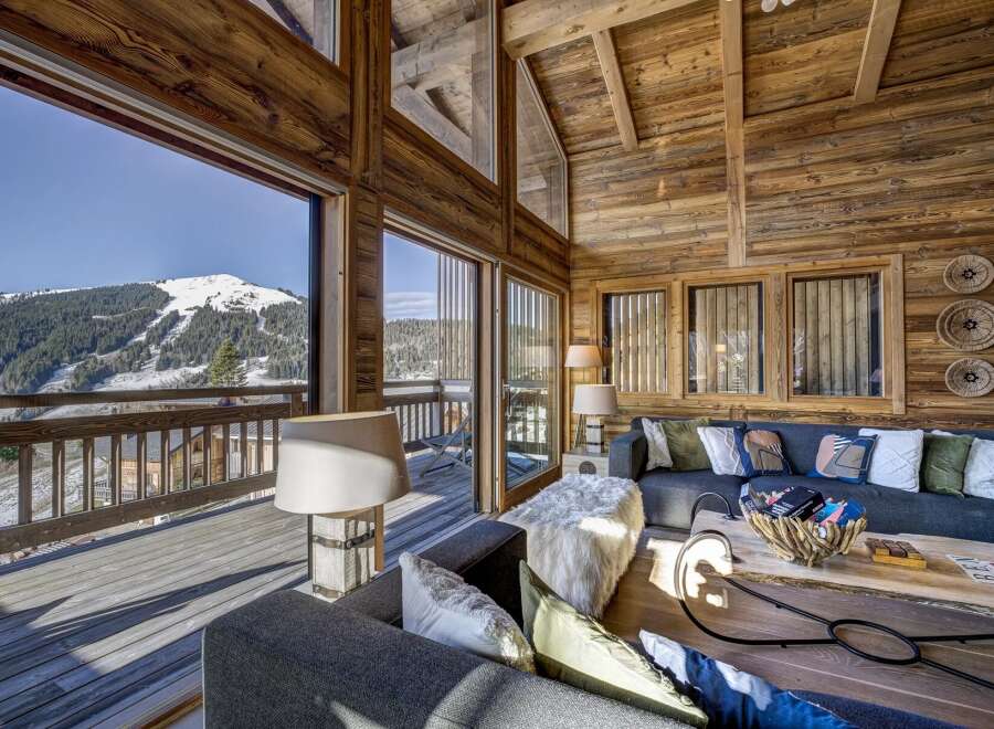Experience the ultimate in luxury living with this stunning chalet boasting breathtaking mountain views.