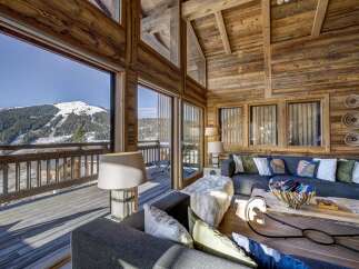 Experience the ultimate in luxury living with this stunning chalet boasting breathtaking mountain views.