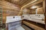 Experience rustic luxury in this stunning bathroom.