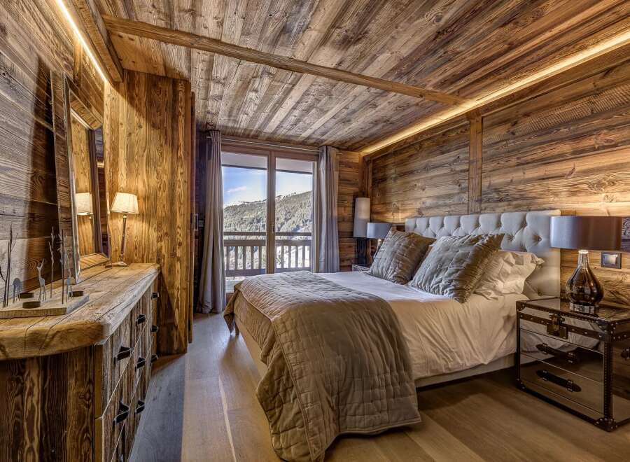 Experience rustic luxury in this stunning bedroom.
