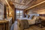 Experience rustic luxury in this stunning bedroom.