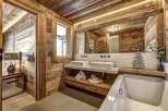 Experience rustic luxury in this stunning bathroom.