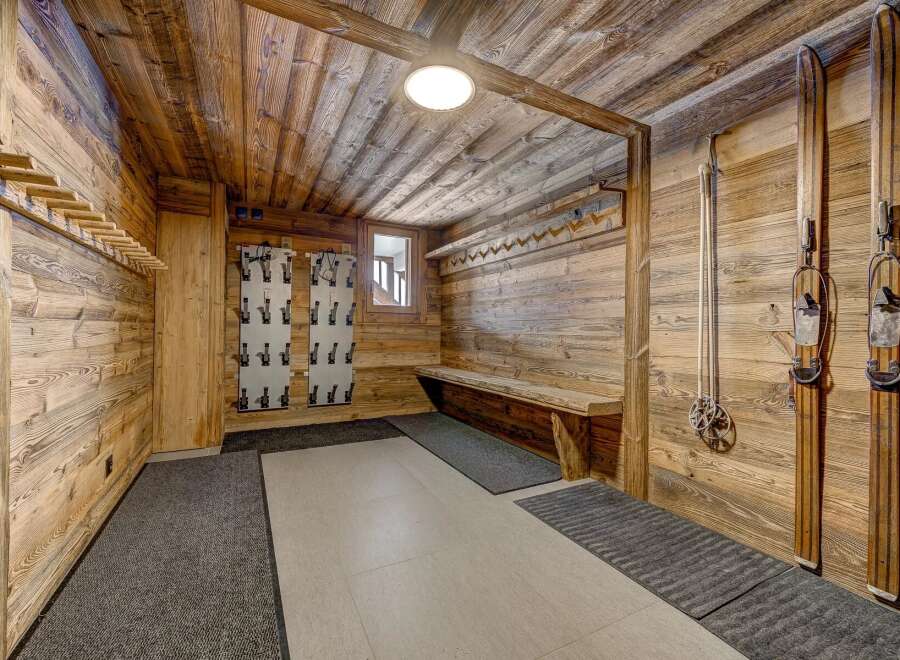 Step into a rustic ski storage room, perfect for organizing your gear.